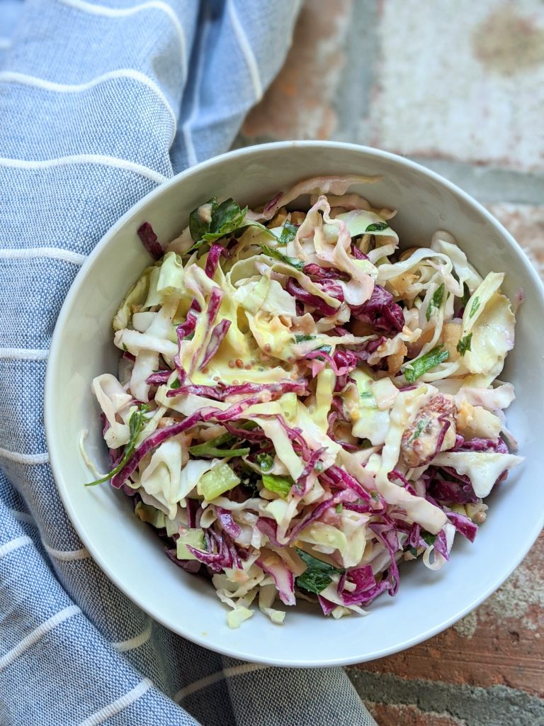 coleslaw with red and green cabbage and walnuts in a sweet dressing