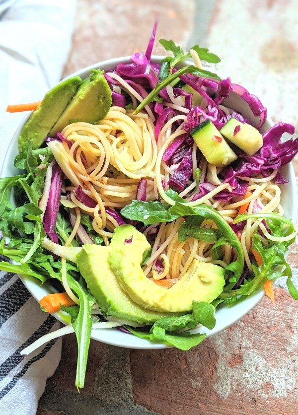 gluten free pasta salad rice noodle recipe asian spring roll salad recipe with avocado arugula cabbage carrots in a lime dressing