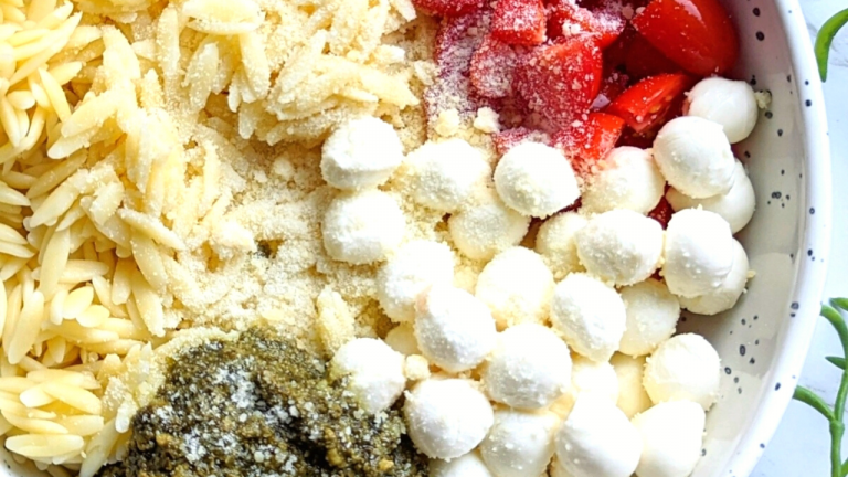 pesto orzo salad with fresh mozzarella salad orzo pasta and cherry tomatoes with parmesan cheese and homemade basil