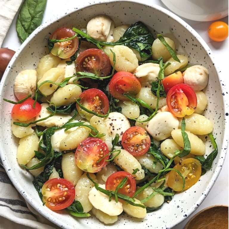 gnocchi caprese pasta recipe with cherry tomatoes and fresh mozzarella cheese in a light parmesan sauce