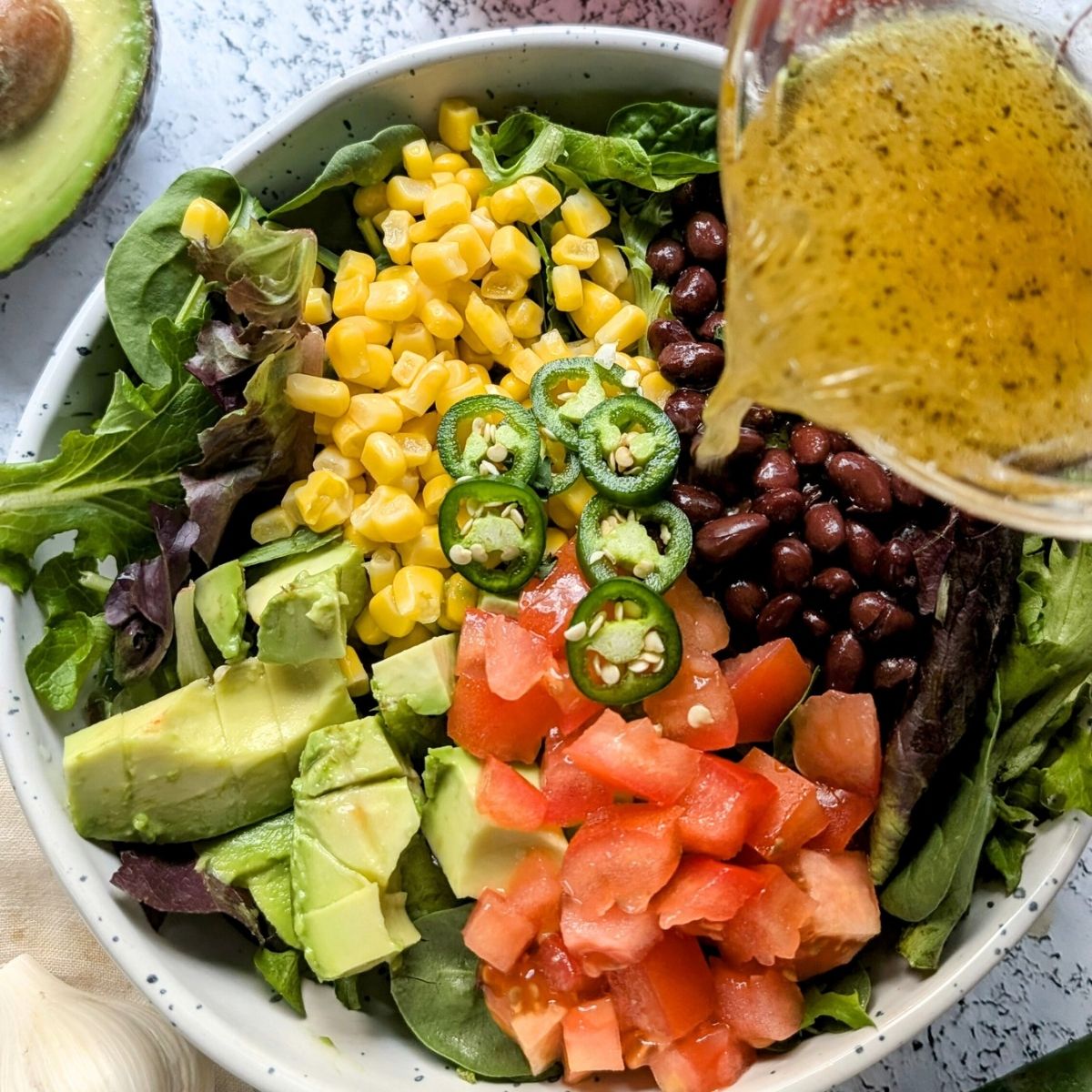 southwest avocado salad with lime vinaigrette dressing in 10 minutes for a hearty vegan and vegetarian side dish for taco night!